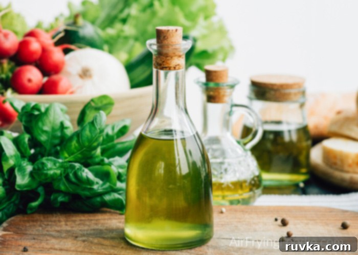 Unlock Your Air Fryer 10 Must-Know Answers 3 To answer questions about which bottle of oil to use in an air fryer, a photo of oil, with vegetables in a bowl in the background