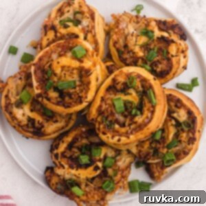 Student Air Fryer Survival Guide 16 Golden BBQ chicken bites with melted mozzarella cheese, topped with fresh green onions, baked in the air fryer.