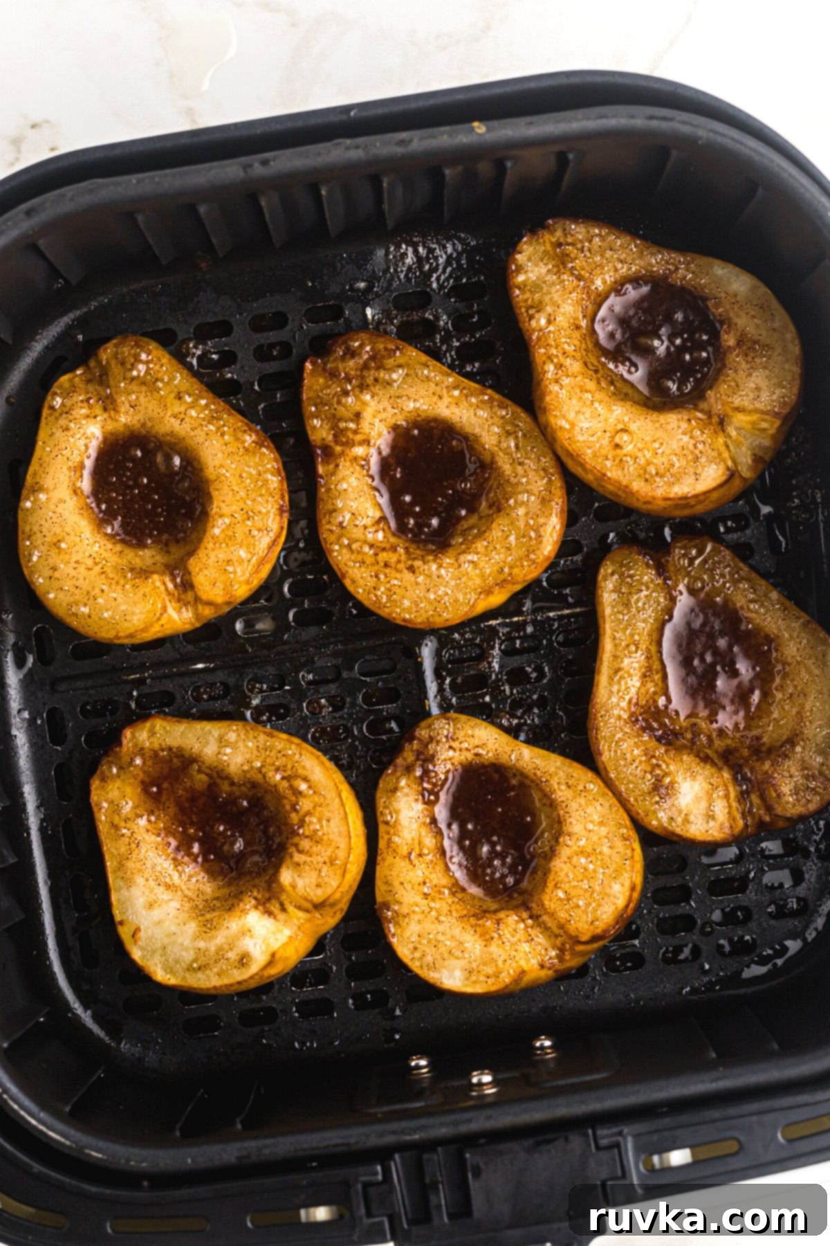Golden Air Fryer Pears 8 Juicy sliced pears with brown sugar and cinnamon mixture melted inside