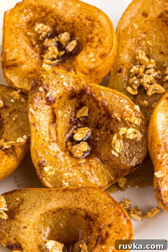 Golden Air Fryer Pears 9 Juicy golden pears on a white plate after being air fried.