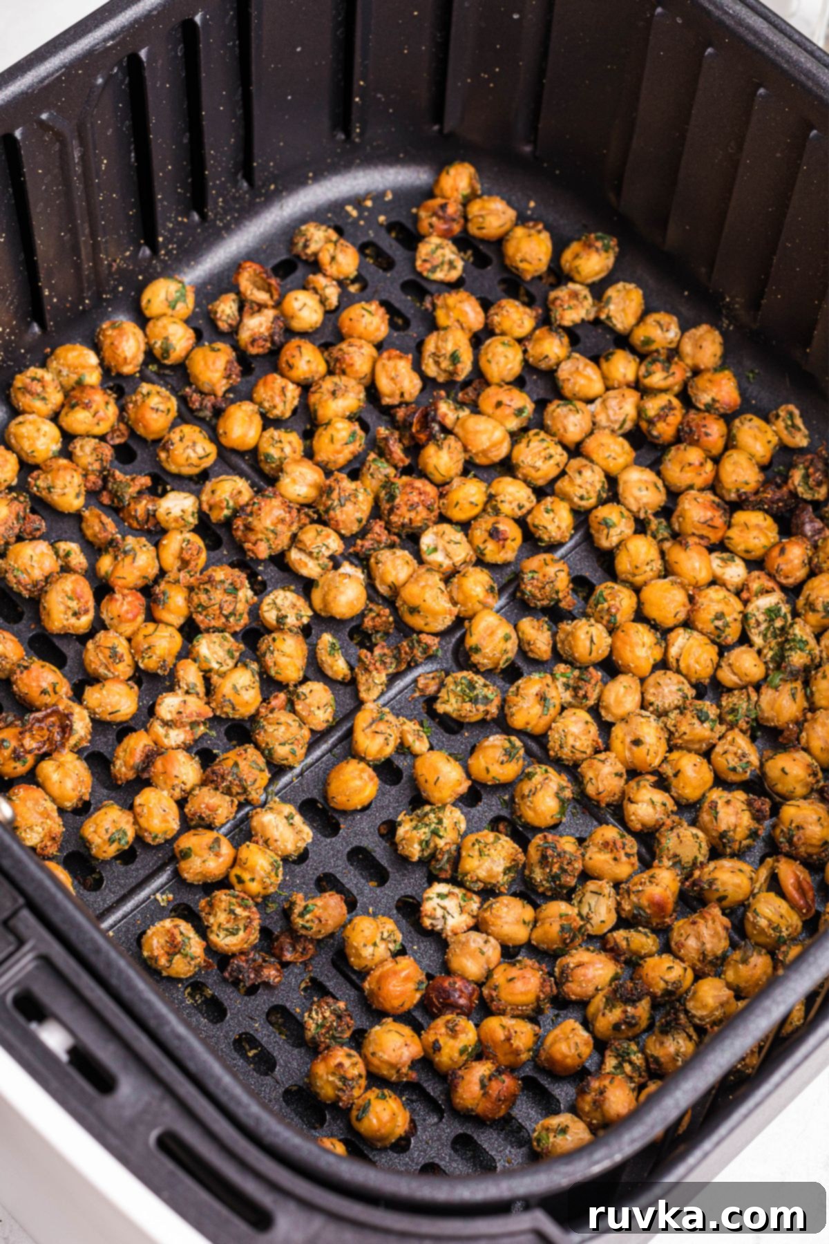 Crispy Air Fryer Chickpeas 7 Golden brown crispy chickpeas in the air fryer basket