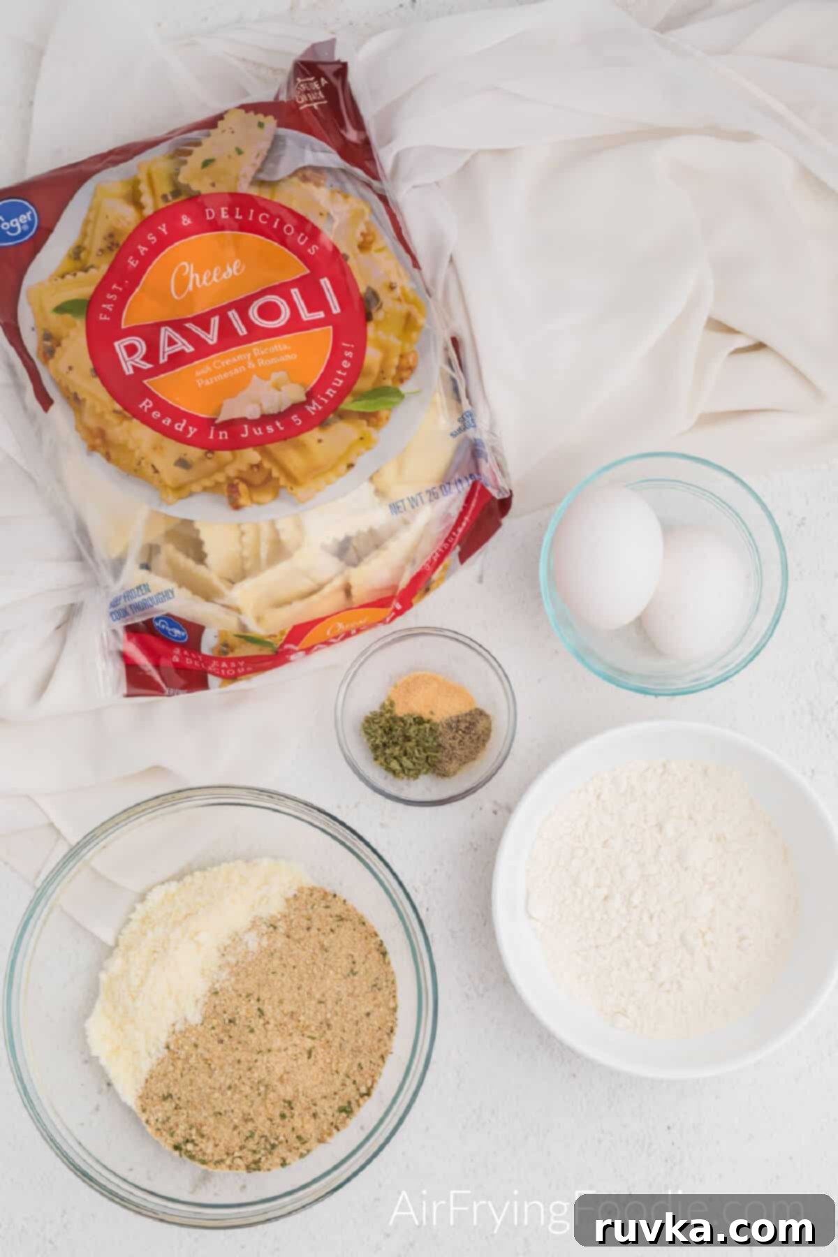Golden Air-Fried Ravioli Bites 3 Frozen cheese ravioli, breadcrumbs, cheese, flour, seasoning, and eggs to make fried ravioli in the air fryer.