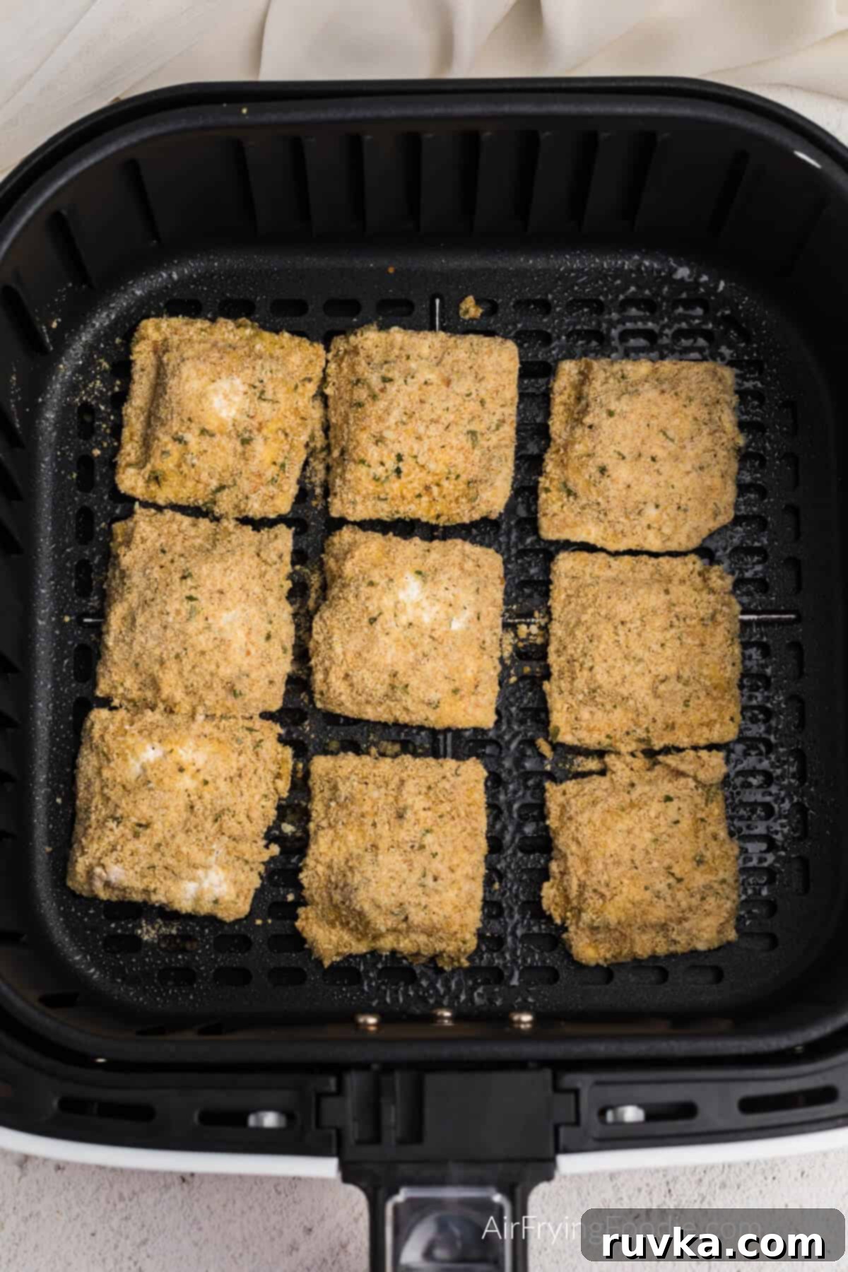 Golden Air-Fried Ravioli Bites 7 Frozen ravioli dipped and coated and placed in a single layer in the air fryer basket. Ready to air fry.