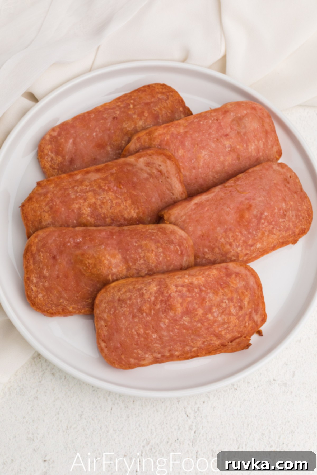 Crispy Air-Fried Spam 7 Air fried Spam on a white plate ready to serve.