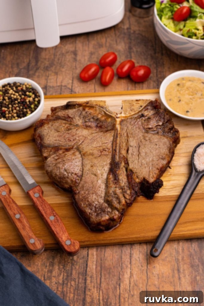 Restaurant-Quality Air Fryer T-Bone 6 Juicy air-fried steak resting on a cutting board, ready to be sliced and served.