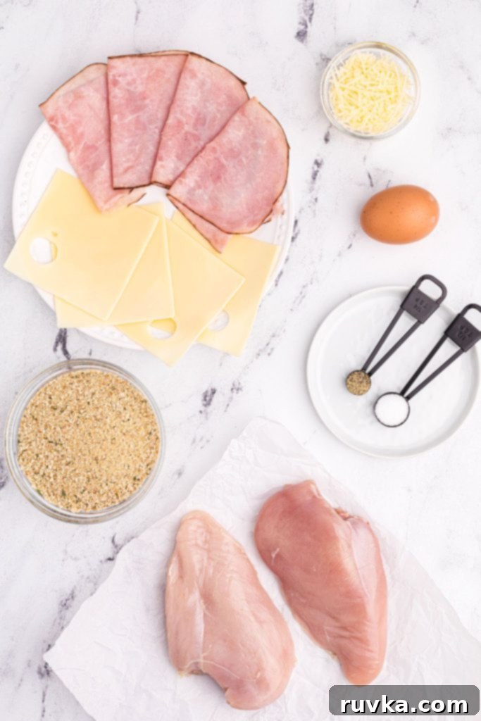 Crispy Air Fryer Chicken Cordon Bleu 3 Ingredients needed to make chicken cordon bleu measured on a white marble table