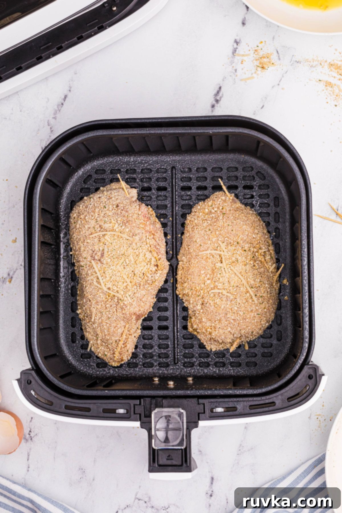 Crispy Air Fryer Chicken Cordon Bleu 9 Breaded stuffed chicken breasts in the air fryer basket