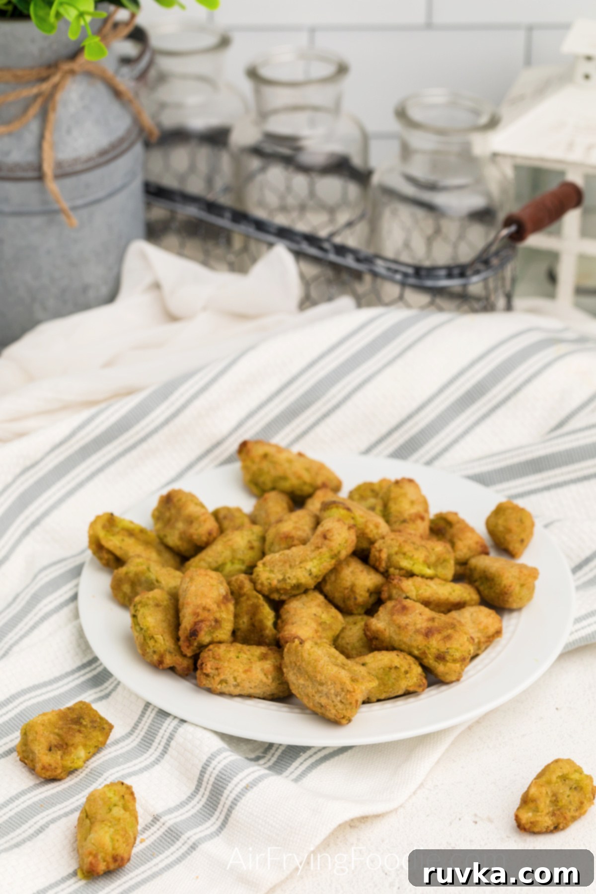 Wholesome Crispy Air Fryer Veggie Tots 2 Air fried veggie tots on a white plate, ready to serve.
