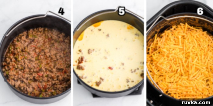 Crispy Air Fryer Taco Bake 5 Taco casserole meat mixture in the baking dish, egg mixture on top of the meat mixture, and finally cheese topped onto the taco casserole mixture.