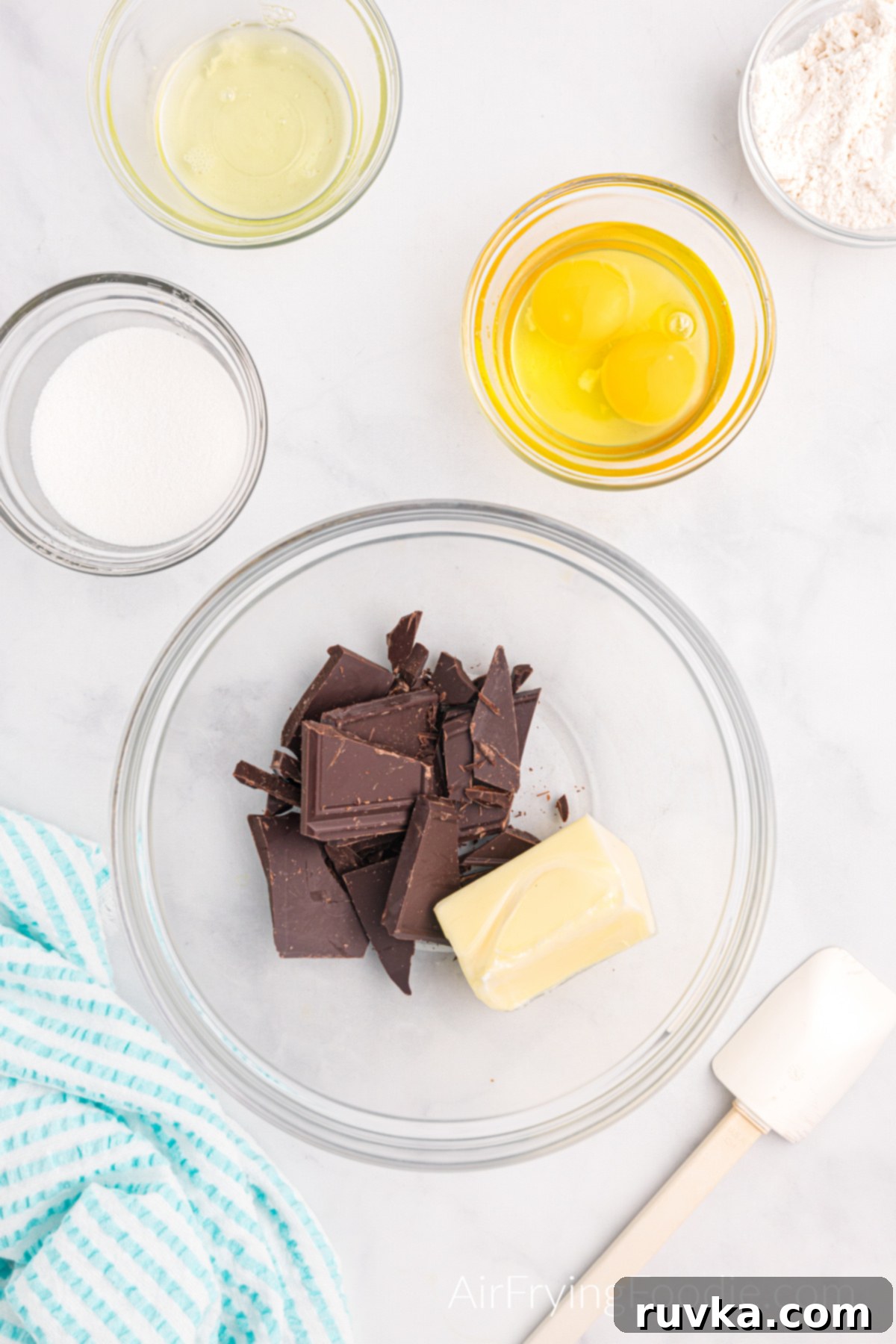 Easy Air Fryer Molten Chocolate Cakes 5 Butter and chocolate in a bowl ready to be melted together.