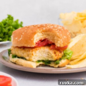 Crispy Air Fryer Chicken Burgers 11 Air Fryer Chicken Burgers, a perfectly cooked chicken patty on a bun.