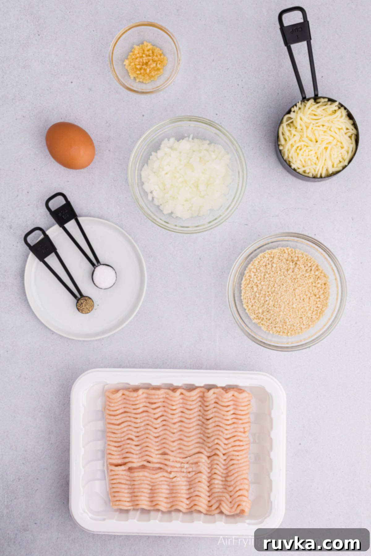 Crispy Air Fryer Chicken Burgers 3 Ingredients on a table that are used to make chicken burgers.