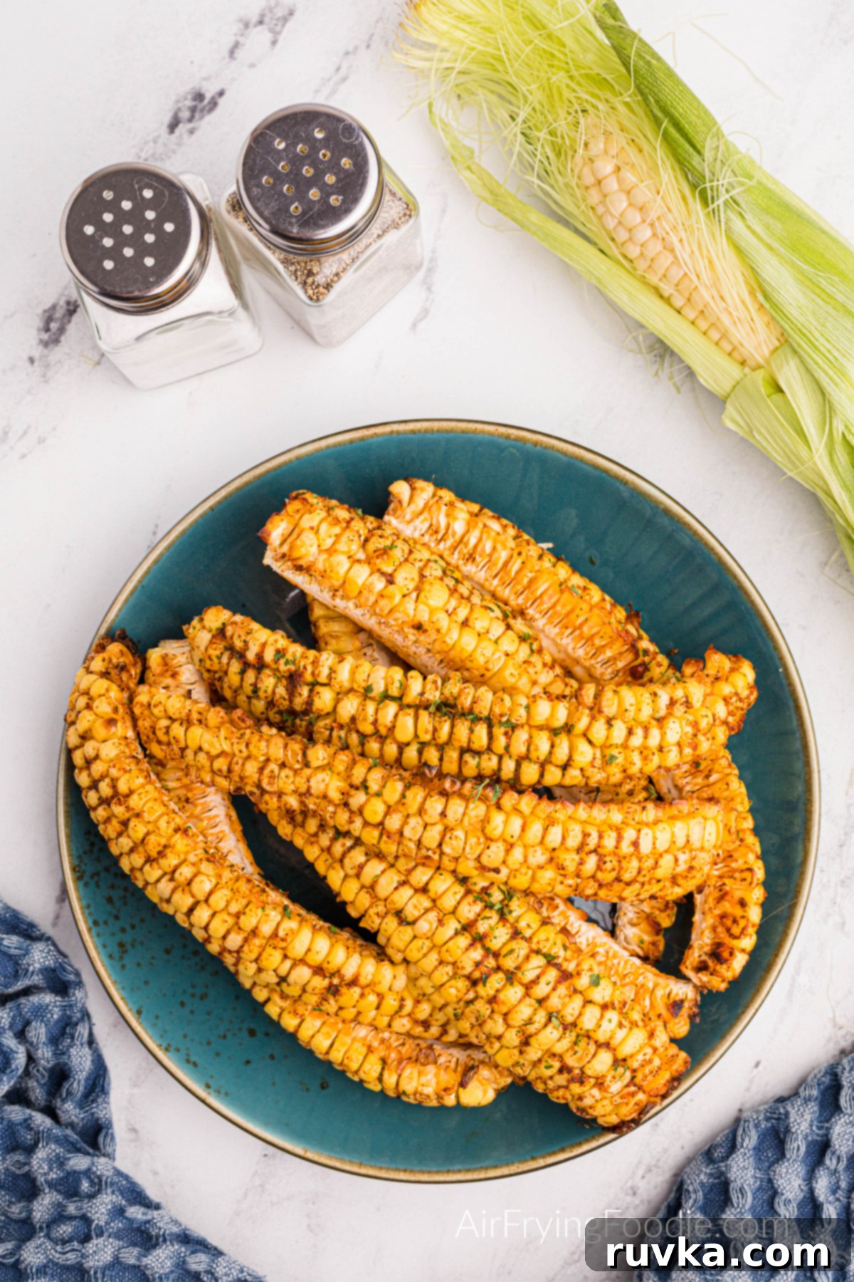 Crispy Air Fried Corn Ribs 9 Delicious Air Fried Corn Ribs served on a plate with an optional dipping sauce on the side.