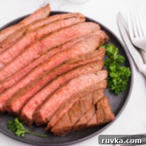 Perfect Air Fryer Flank Steak 13 Flank steak sliced and served on a platter.