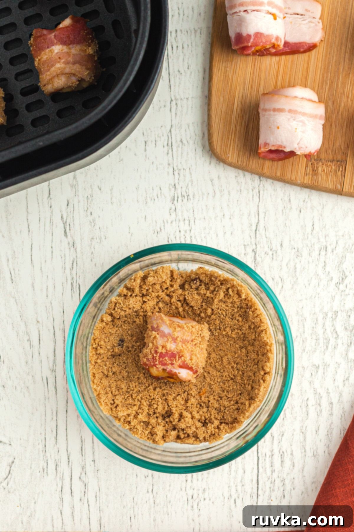 Crispy Air Fryer Bacon-Wrapped Tater Tots 6 Bacon wrapped tater tots rolled in brown sugar and then placed in air fryer basket