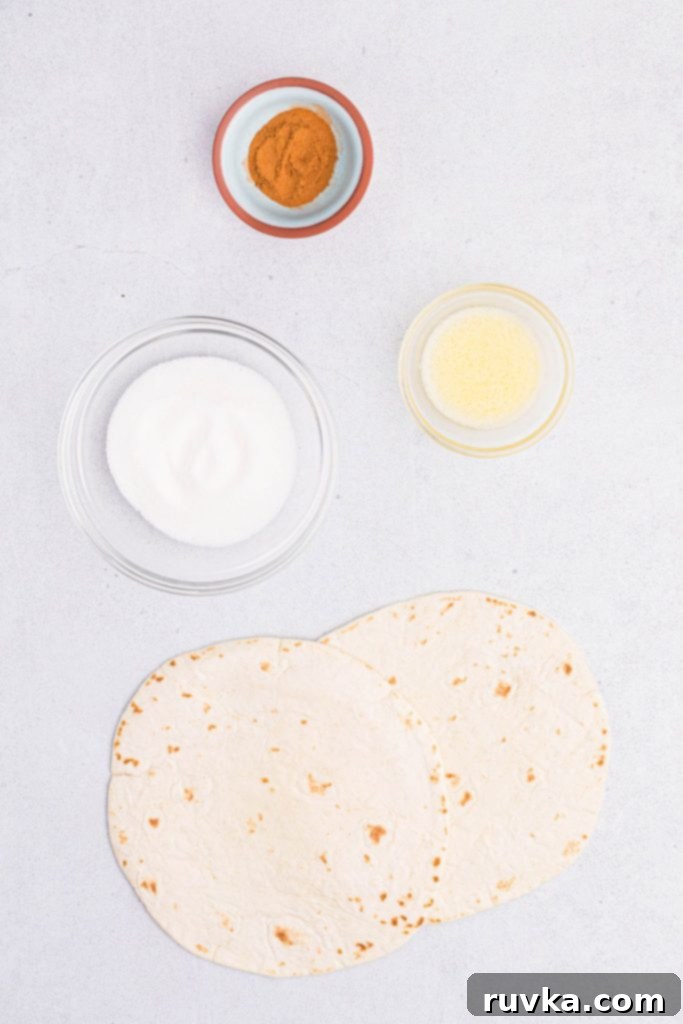 Crispy Air Fryer Cinnamon Sugar Tortilla Chips 4 Ingredients needed to make cinnamon sugar tortilla chips measured on a white table
