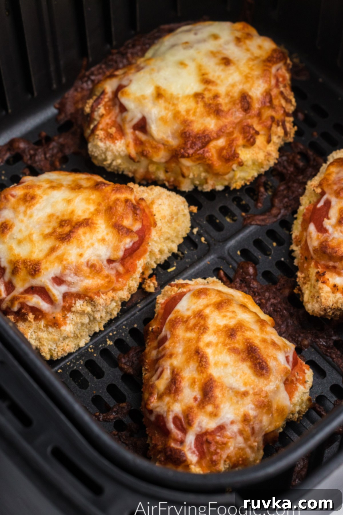 Crispy Air Fryer Chicken Parmesan 7 chicken parmesan in the basket of the air fryer.