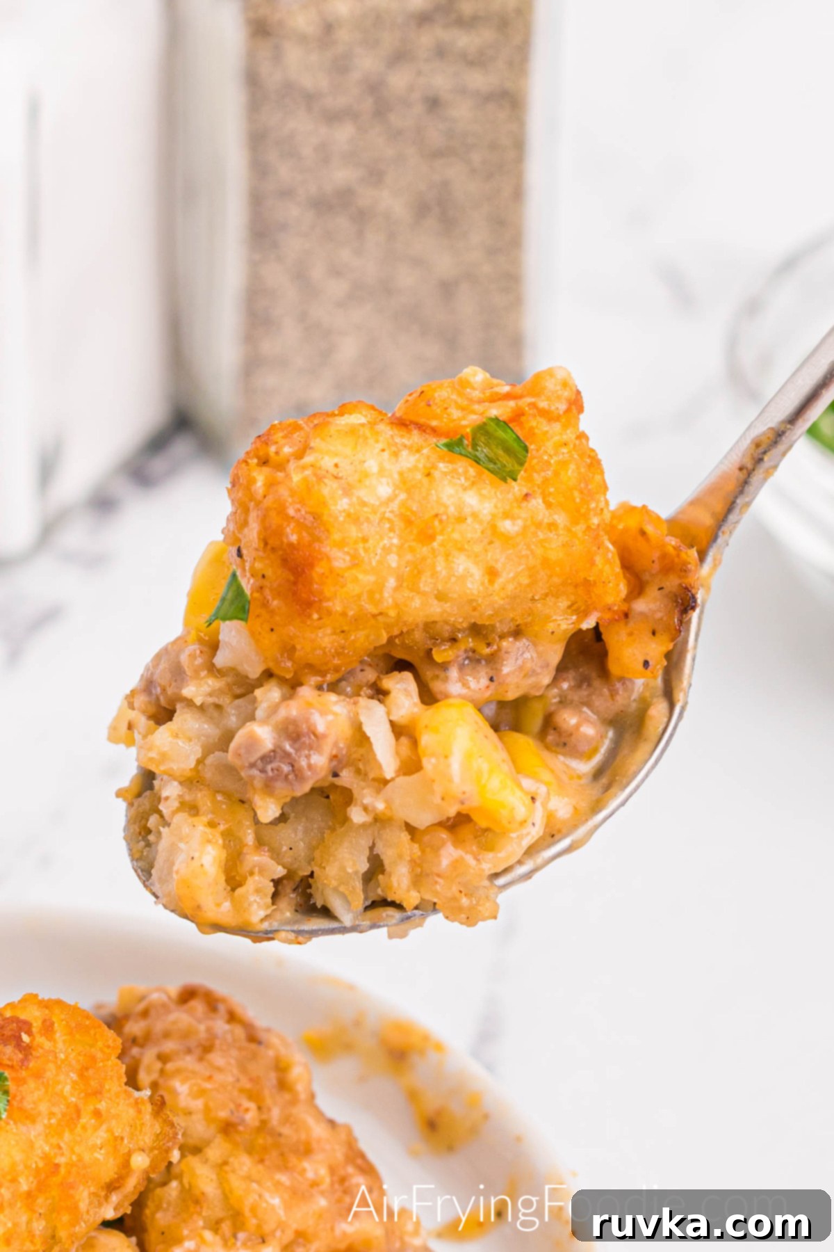 Hearty Air Fryer Cowboy Casserole 10 A spoonful of fully cooked cowboy casserole made in the air fryer.