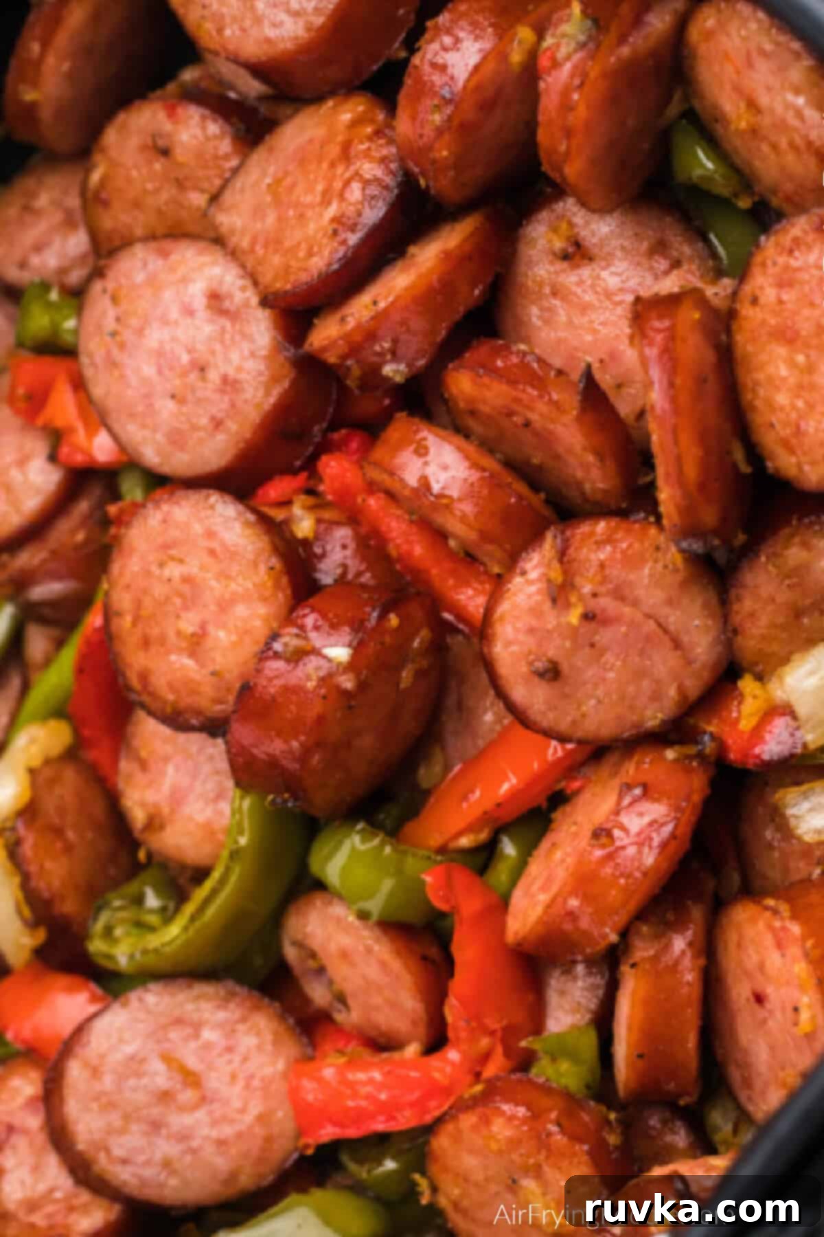 Crispy Air Fryer Sausage and Peppers 7 Close up photo of cooked air fryer sausage and peppers.