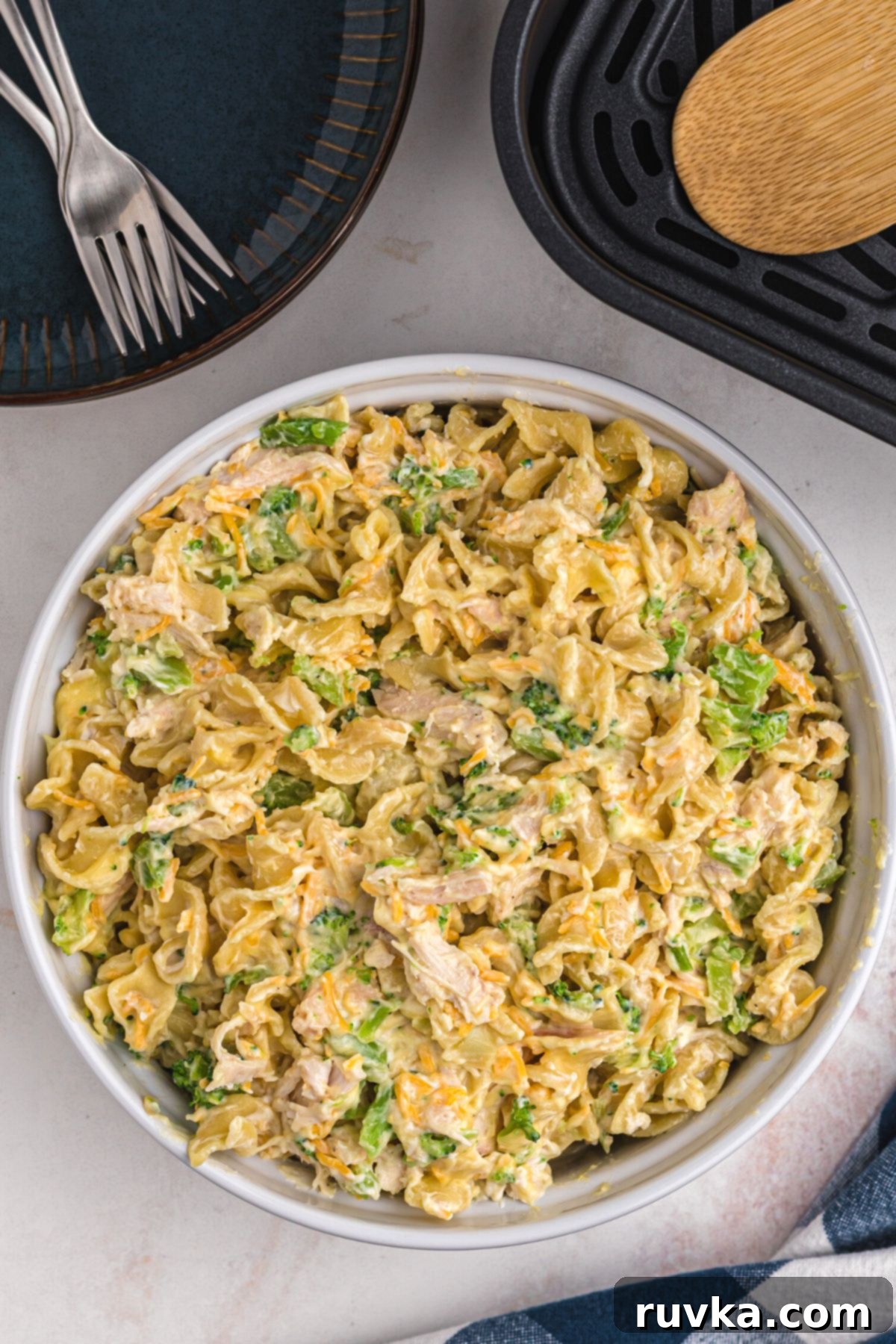 Crispy Air Fryer Chicken Casserole 6 Chicken casserole ingredients mixed together and transferred into a white casserole dish, ready for the air fryer.