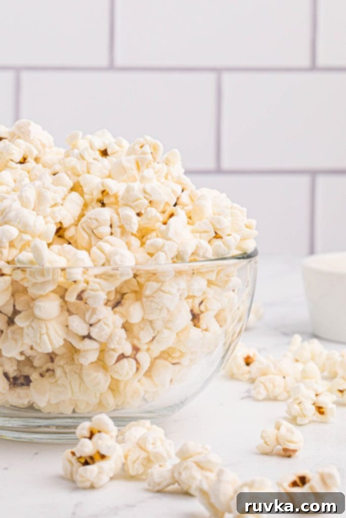 Air-Popped Perfection 3 White fluffy popcorn in a clear glass bowl.