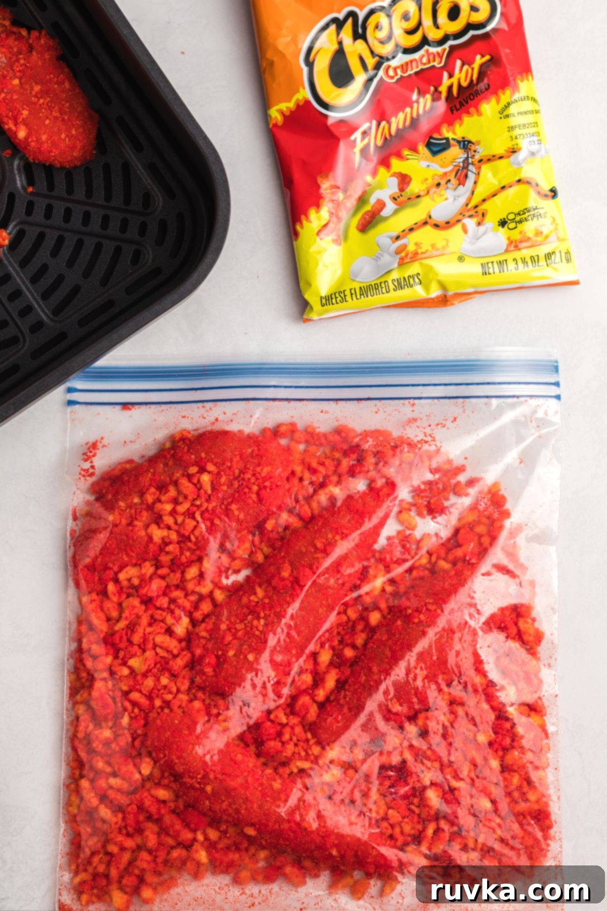 Crispy Air Fried Flamin Hot Cheetos Chicken 6 Coated chicken in a ziplock bag