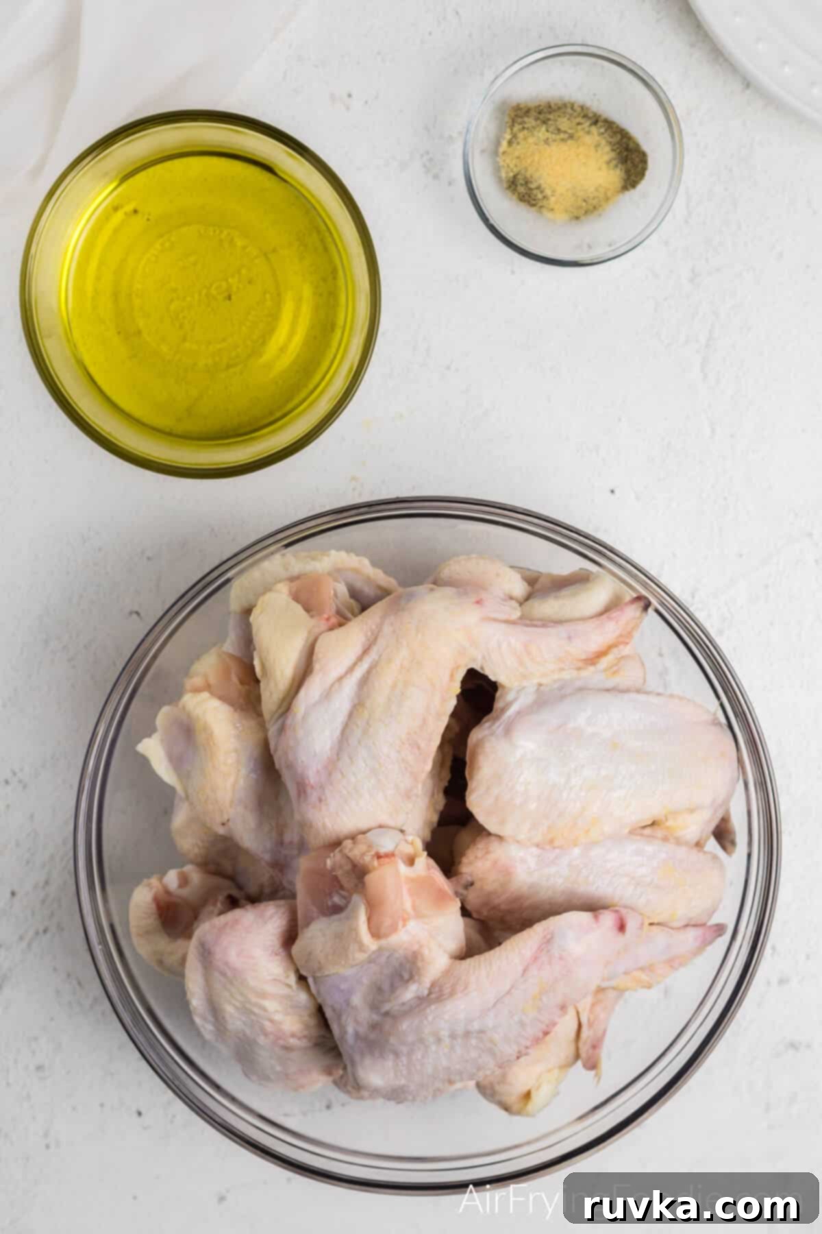 Crispy Air-Fried BBQ Wings 3 Ingredients for Air Fryer BBQ Chicken Wings: olive oil, garlic powder, brown sugar, BBQ sauce, and chicken wings.
