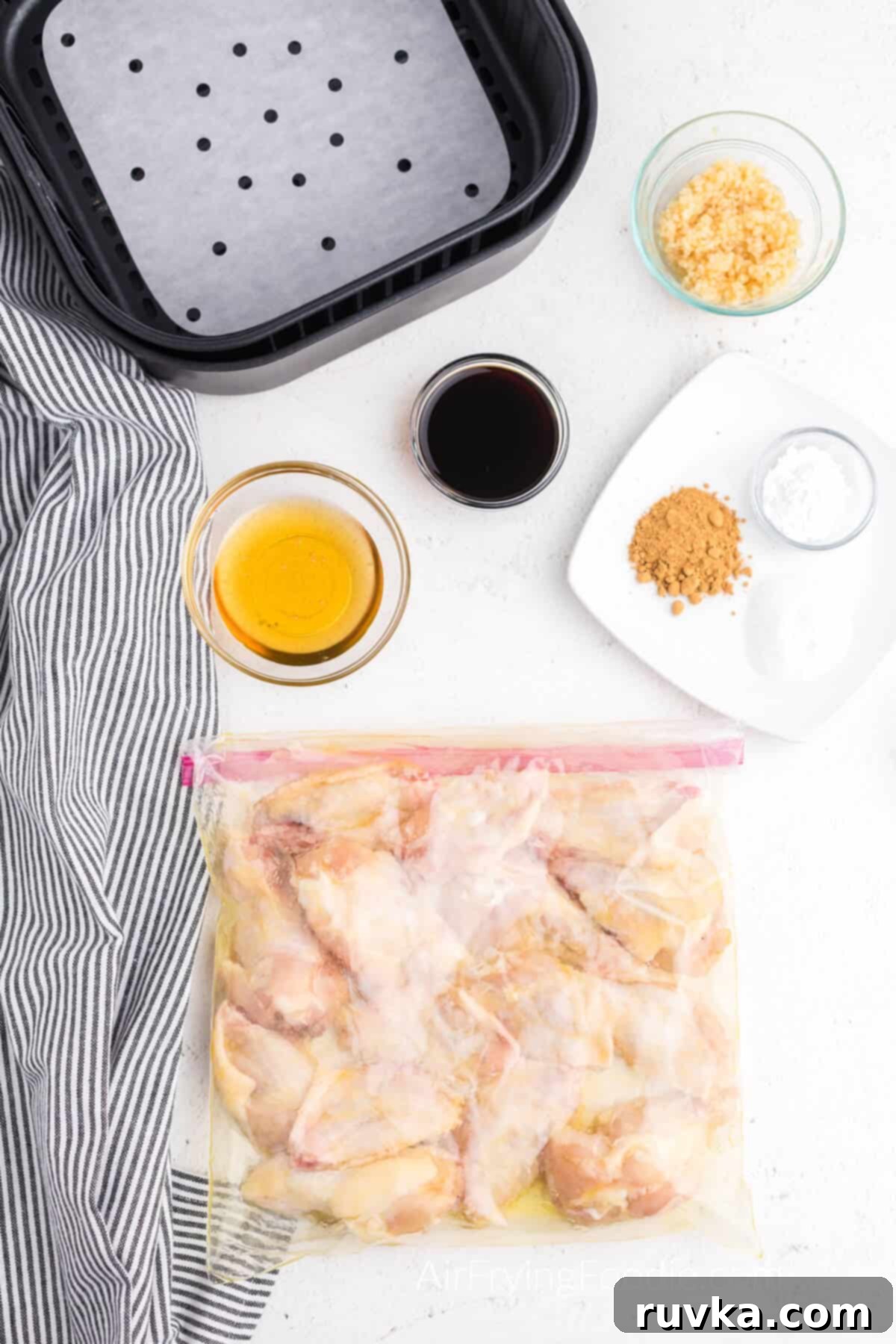 Crispy Honey Garlic Air Fryer Wings 5 Chicken wings in a bag with olive oil.