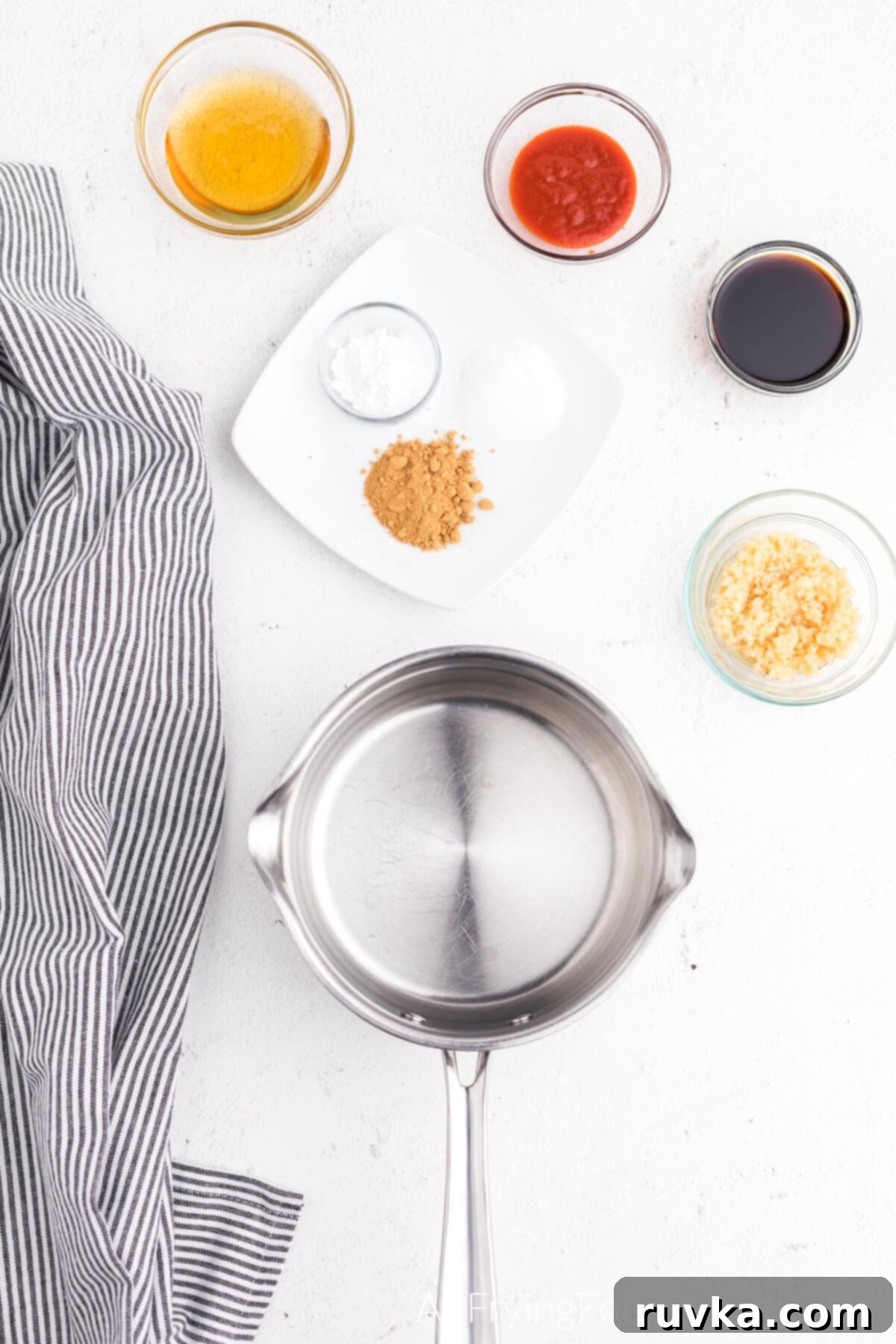 Crispy Honey Garlic Air Fryer Wings 7 Ingredients for the wing sauce ready to be cooked in a saucepan.