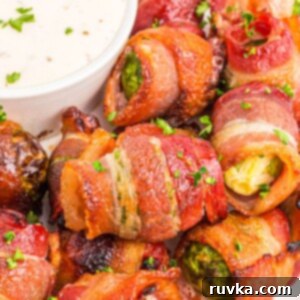 Crispy Air Fryer Bacon Brussels Bites 9 Golden crispy bacon wrapped around brussels sprouts after being cooked in the air fryer.