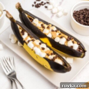 Air Fryer Golden Banana Delight 9 Bananas sliced open and stuffed with marshmallows and chocolate chips, then air fried until golden and gooey.