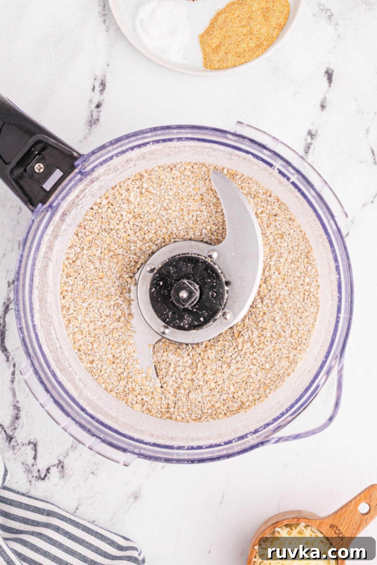 Crispy Golden Oat Air Fryer Chicken 4 Oats chopped in a food processor with seasonings.