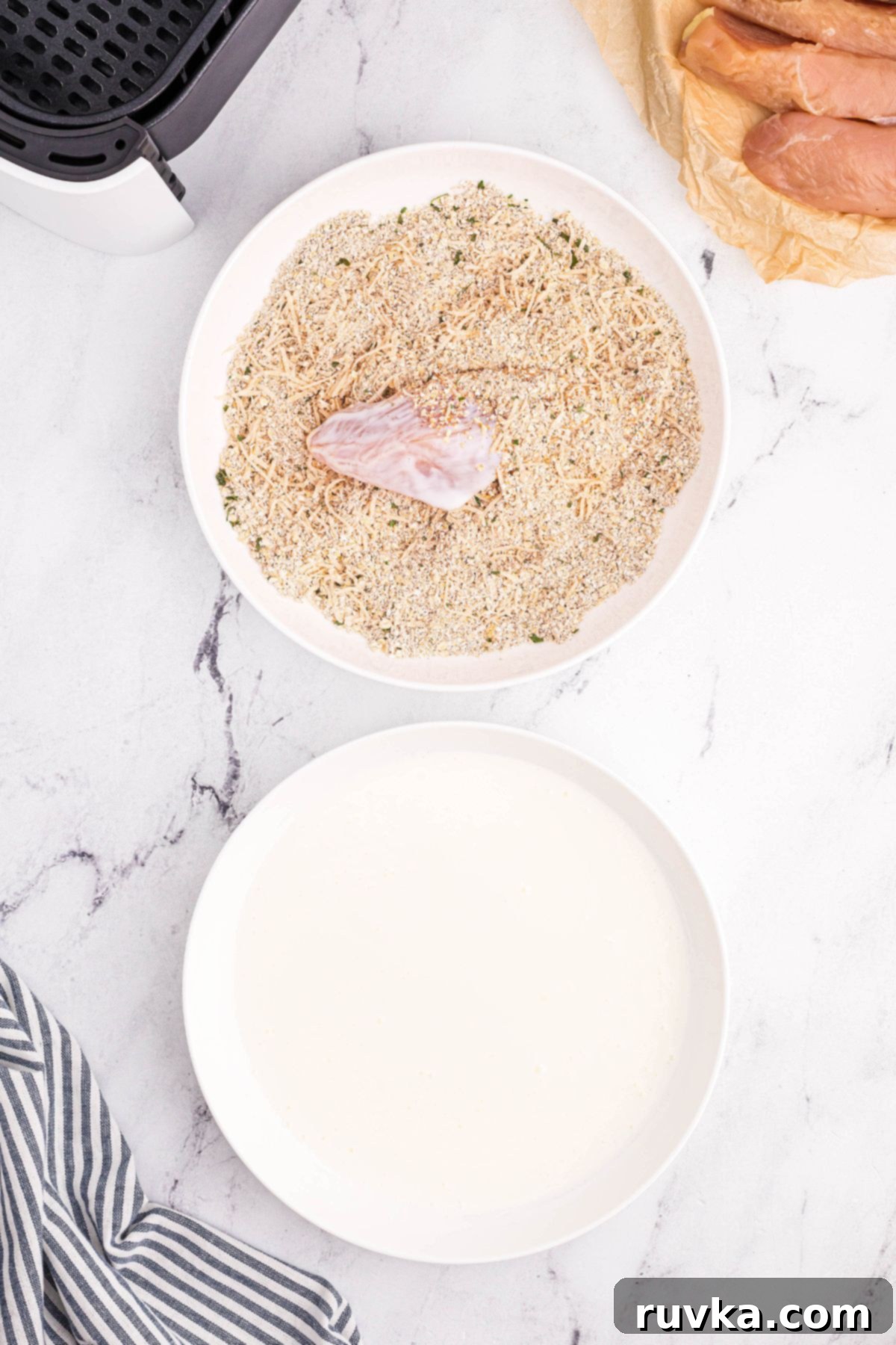 Crispy Golden Oat Air Fryer Chicken 5 Chicken being coated with chopped oats and seasonings