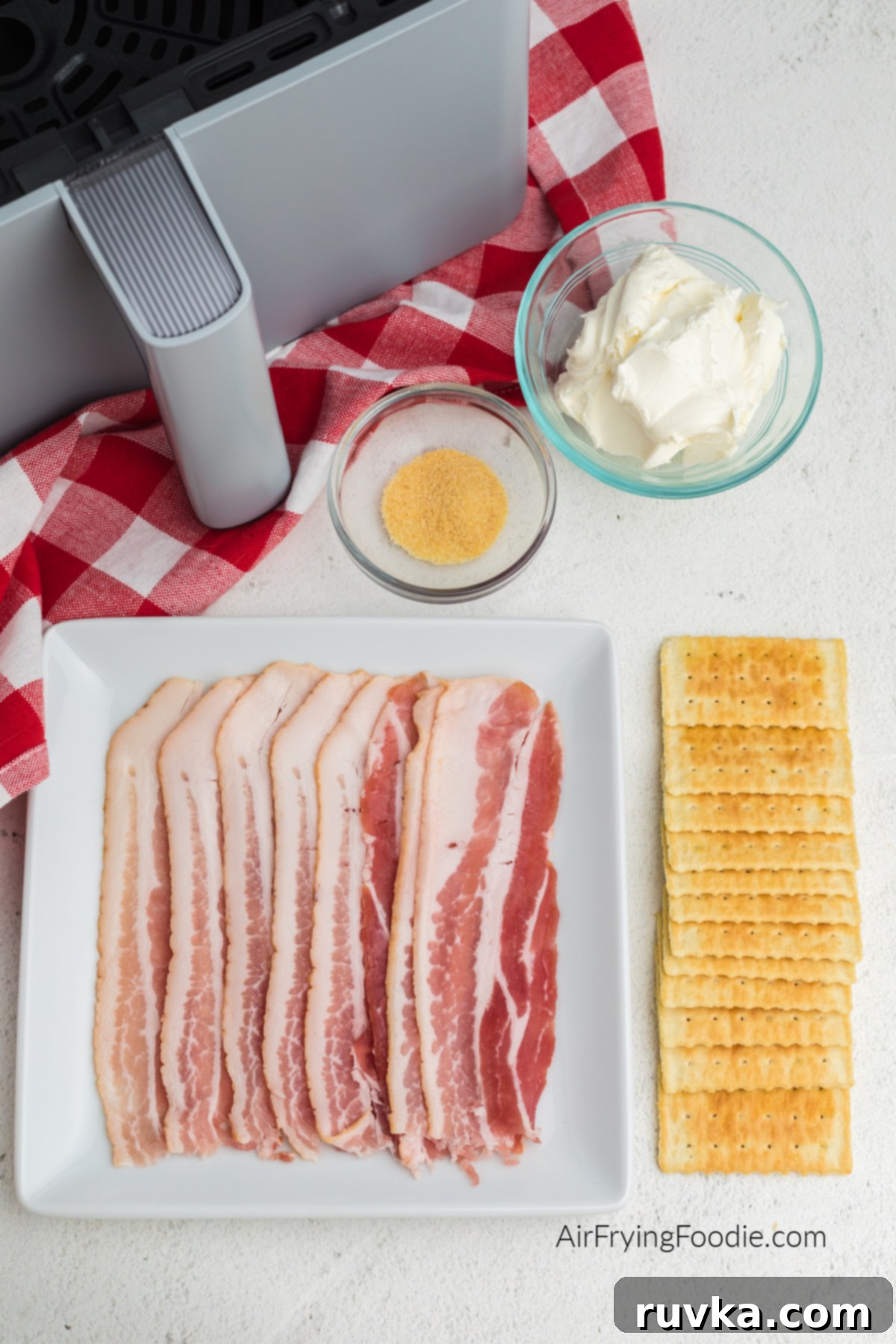 Air Fryer Bacon Cream Cheese Cracker Bites 3 Club crackers, cream cheese, onion powder, and bacon slices.