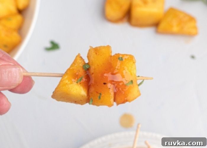 Air Fried Honey BBQ Pineapple 6 Juicy glazed pineapple on a toothpick, ready for a party or as an appetizer.