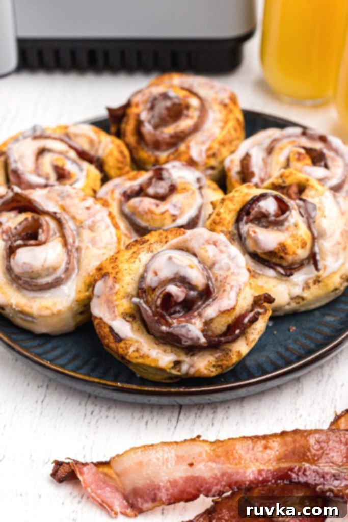 Air Fried Bacon Cinnamon Delights 8 Golden crispy cinnamon rolls wrapped around bacon slices and then frosted.