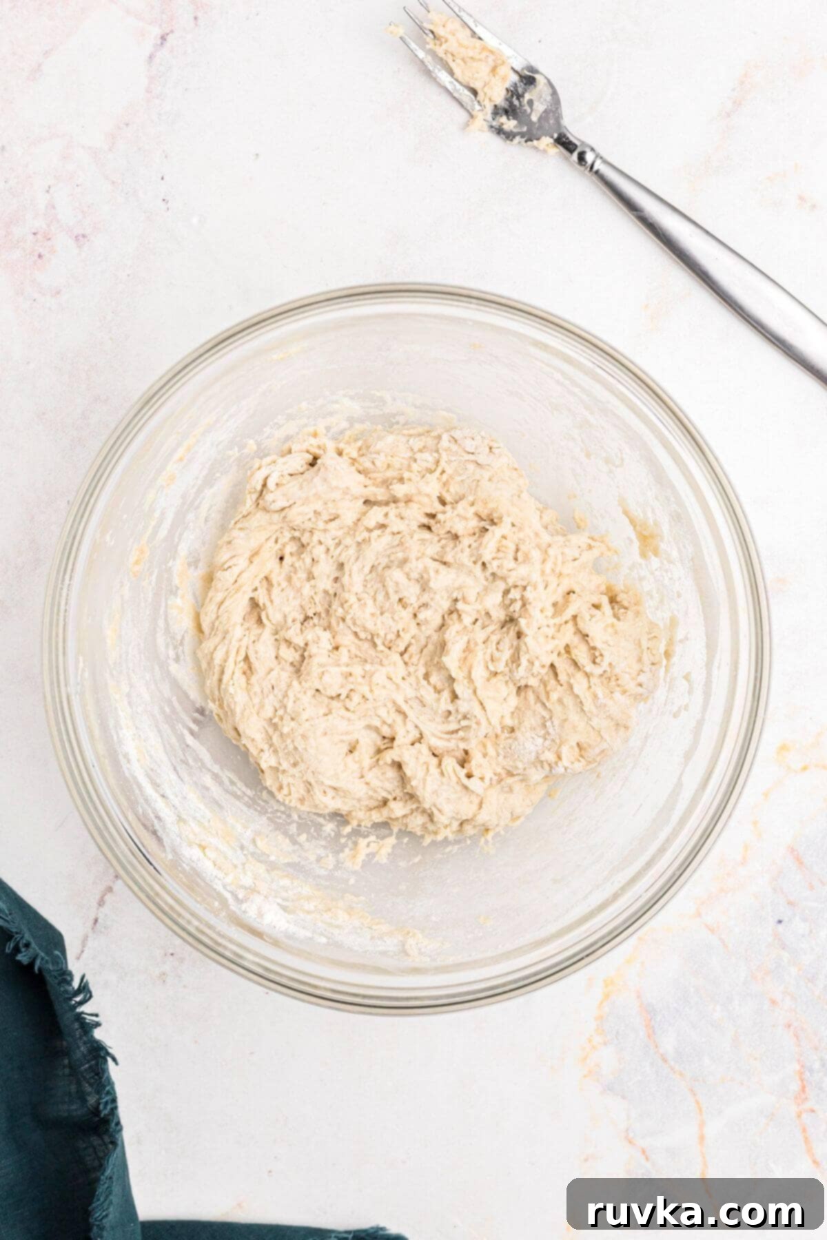 Perfectly Soft Air Fryer Pretzels 5 Dough mixed together in a clear glass bowl.
