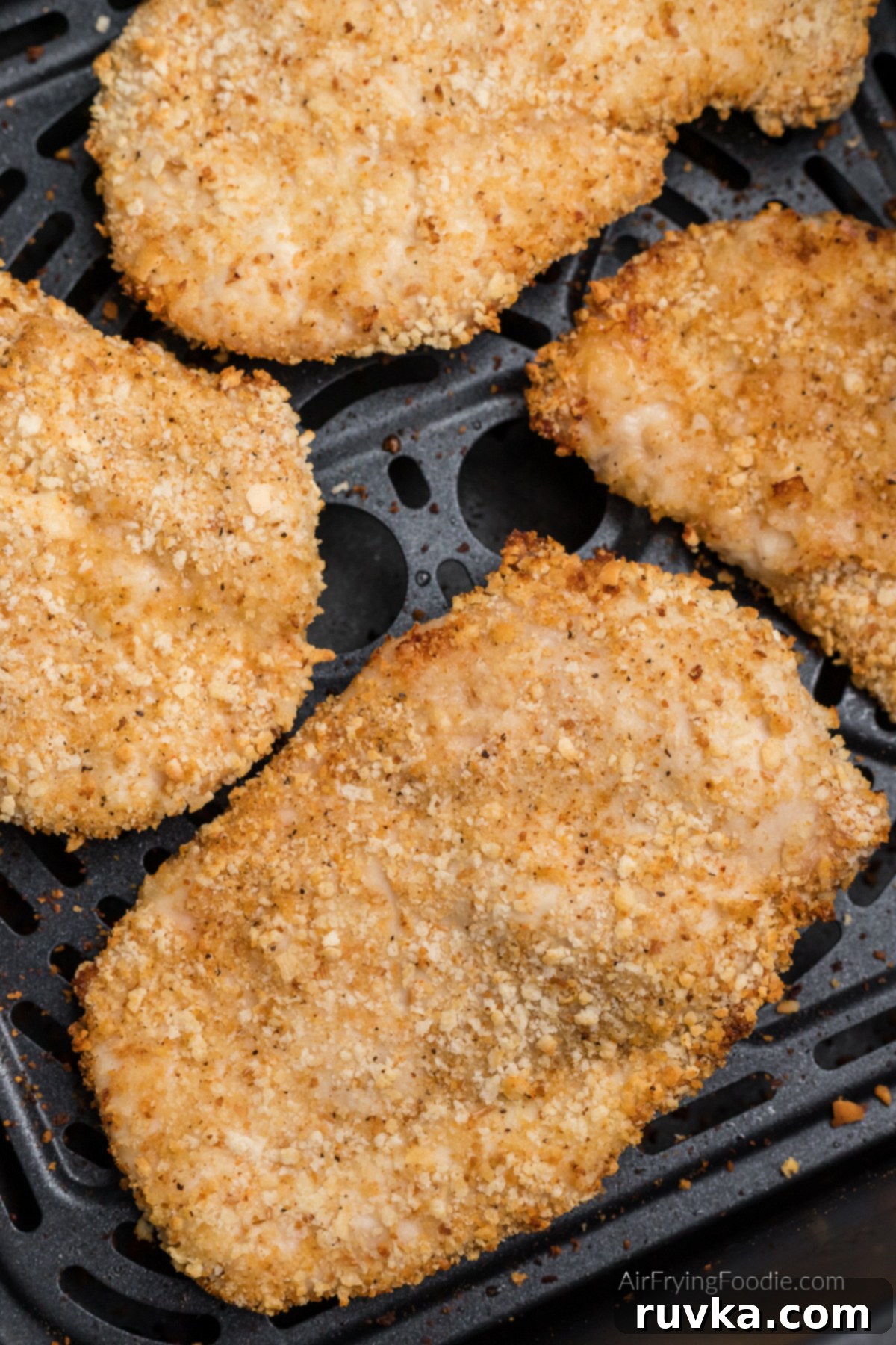 Crispy Air-Fried Chicken Breast 7 Fried chicken breast in basket of the air fryer.
