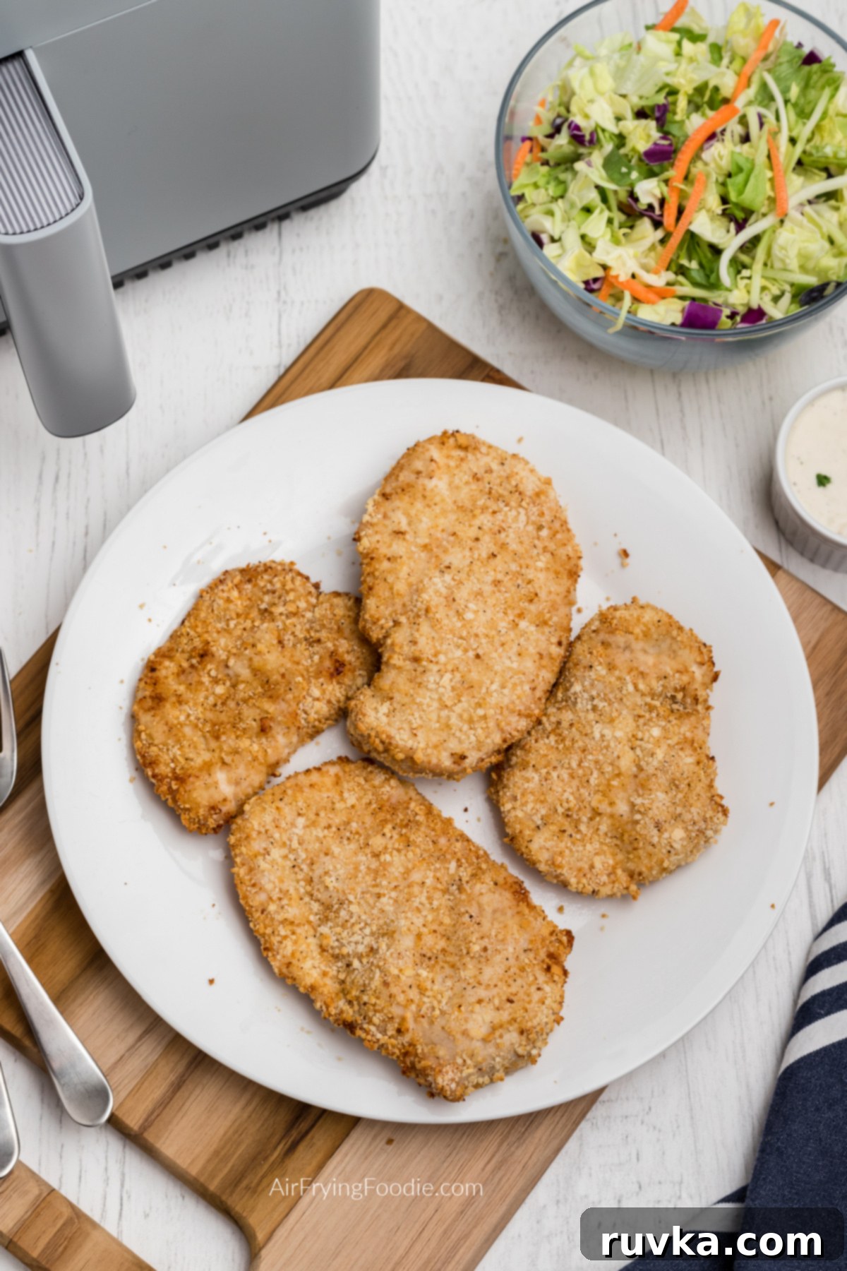 Crispy Air-Fried Chicken Breast 8 air fryer Fried chicken breast on a white plate and ready to serve