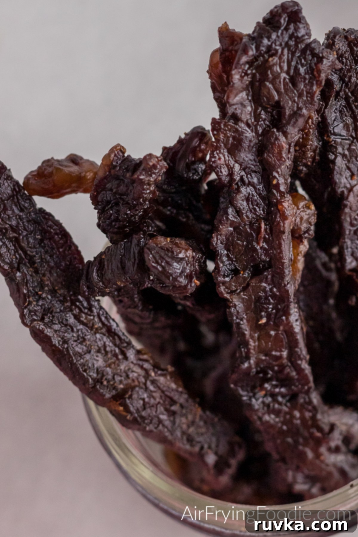 Homemade Air Fryer Jerky 10 Close up photo of beef jerky in a jar that was made in the air fryer.