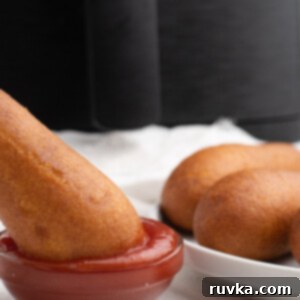 Air Frying Made Simple 18 Perfectly cooked Air Fryer Corn Dogs, golden brown and crispy.