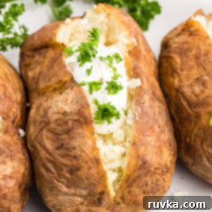 Air Frying Made Simple 4 Perfectly baked potatoes with crispy skin and fluffy insides, ready for your favorite toppings.