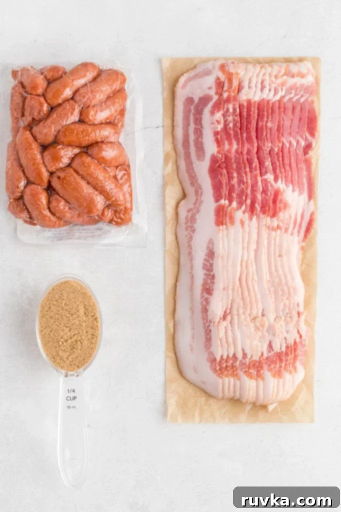 Crispy Air-Fried Bacon-Wrapped Smokies 3 Uncooked bacon, a scoop of brown sugar, and a package of little smokies on a white marble table.