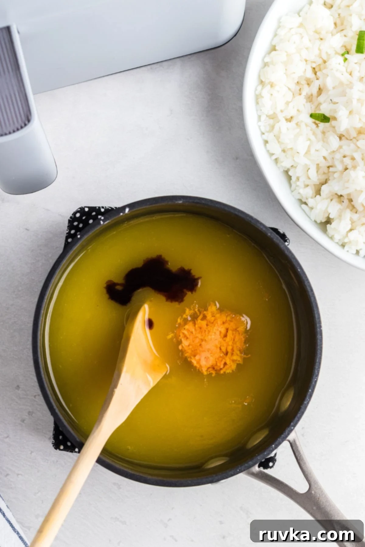 Golden Crispy Air Fryer Orange Chicken 6 Orange sauce being made in a sauce pan