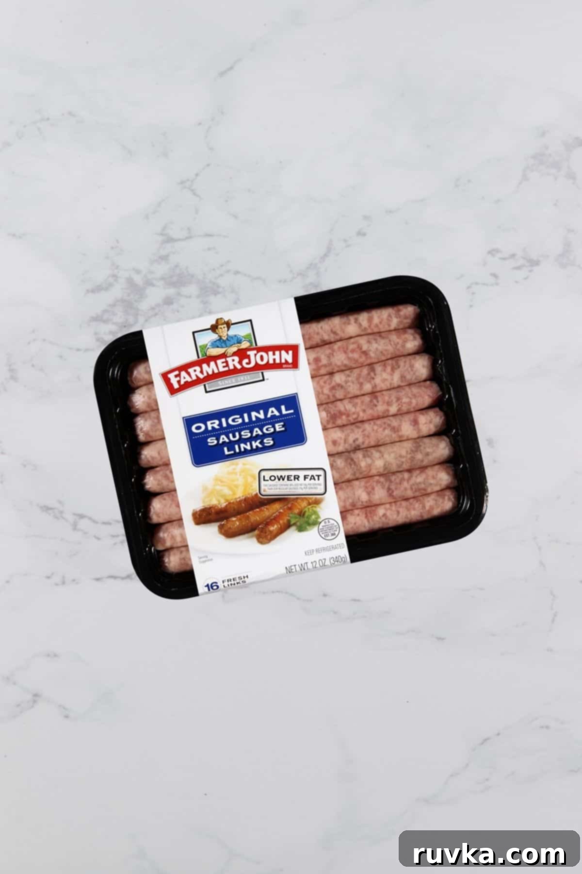 Crispy Air Fryer Sausage Links 3 Package of sausage links on a marble table.
