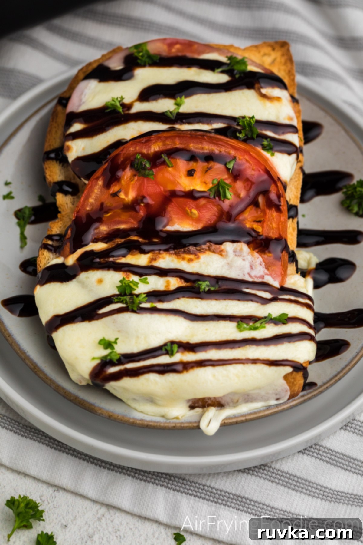 Air Fryer Caprese Melts 38 Caprese grilled cheese made in the air fryer and topped with fresh chopped parsley and balsamic glaze.