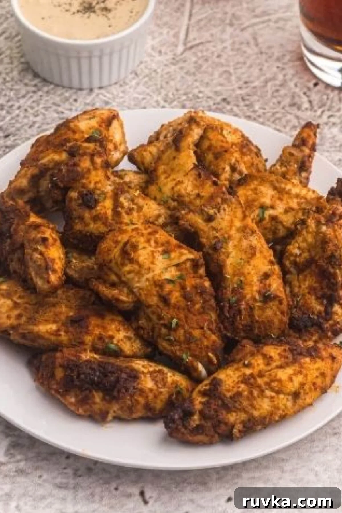 Delicious Air Fryer Chicken Recipes Made Easy 24 Air fryer blackened chicken tenders, seasoned with chili powder and cayenne pepper, served on a plate.