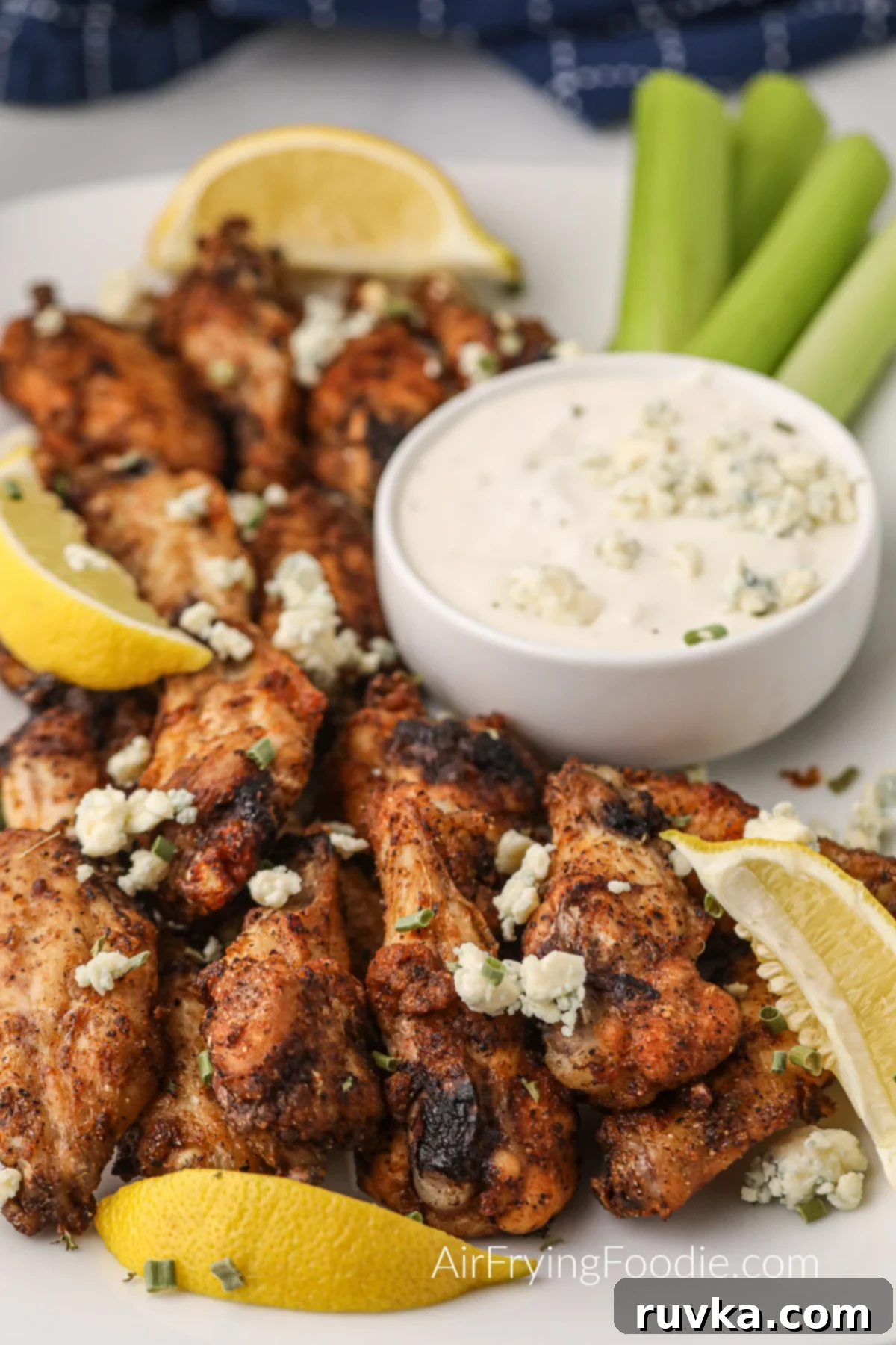 Delicious Air Fryer Chicken Recipes Made Easy 48 Air fried lemon pepper wings, golden and tangy, served with a side of dipping sauce.