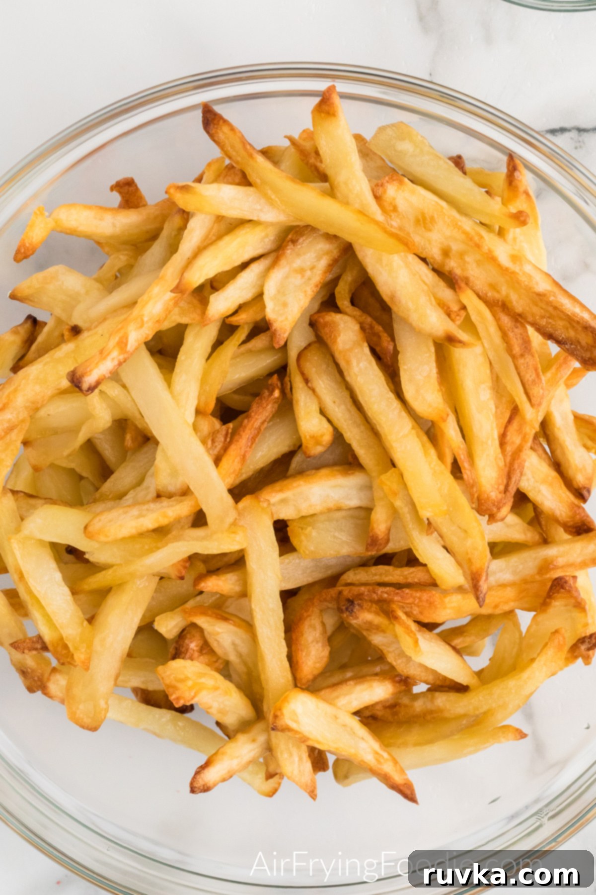 Crispy Leftover Fries in Your Air Fryer 3 Leftover fries in a bowl, ready to be transformed into crispy perfection in the air fryer.