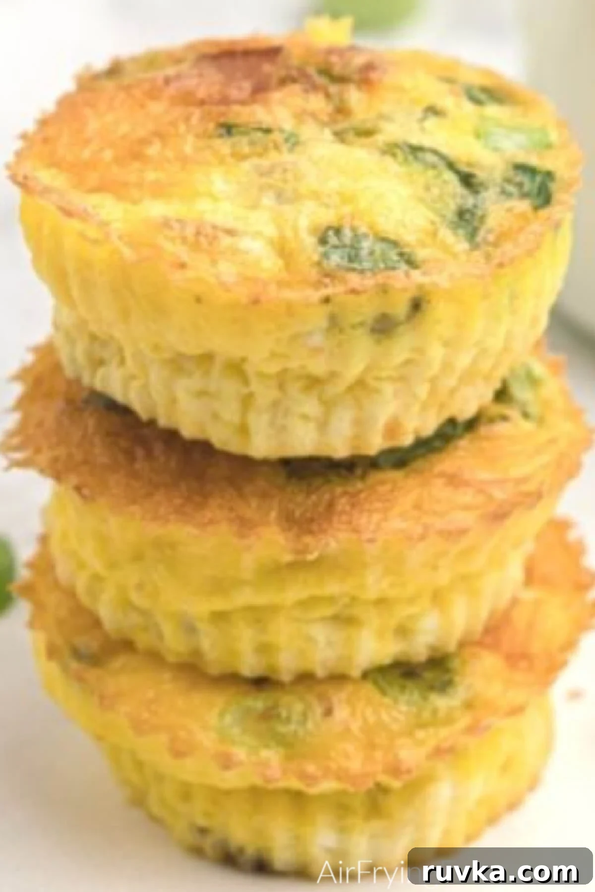 Easy Air Fryer Egg Bites 7 Air fryer egg cups stacked after cooking, and ready to eat.